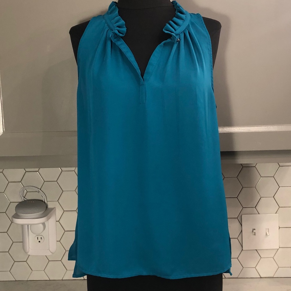 Teal sleeveless blouse with ruffle collar